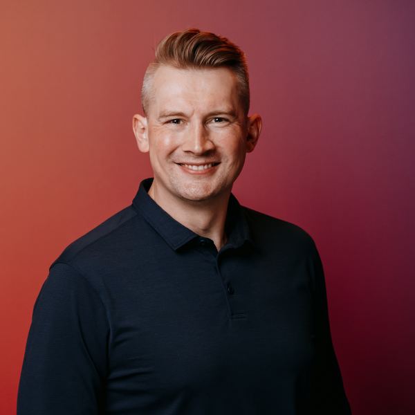 Viktor Gamov, smiling studio portrait